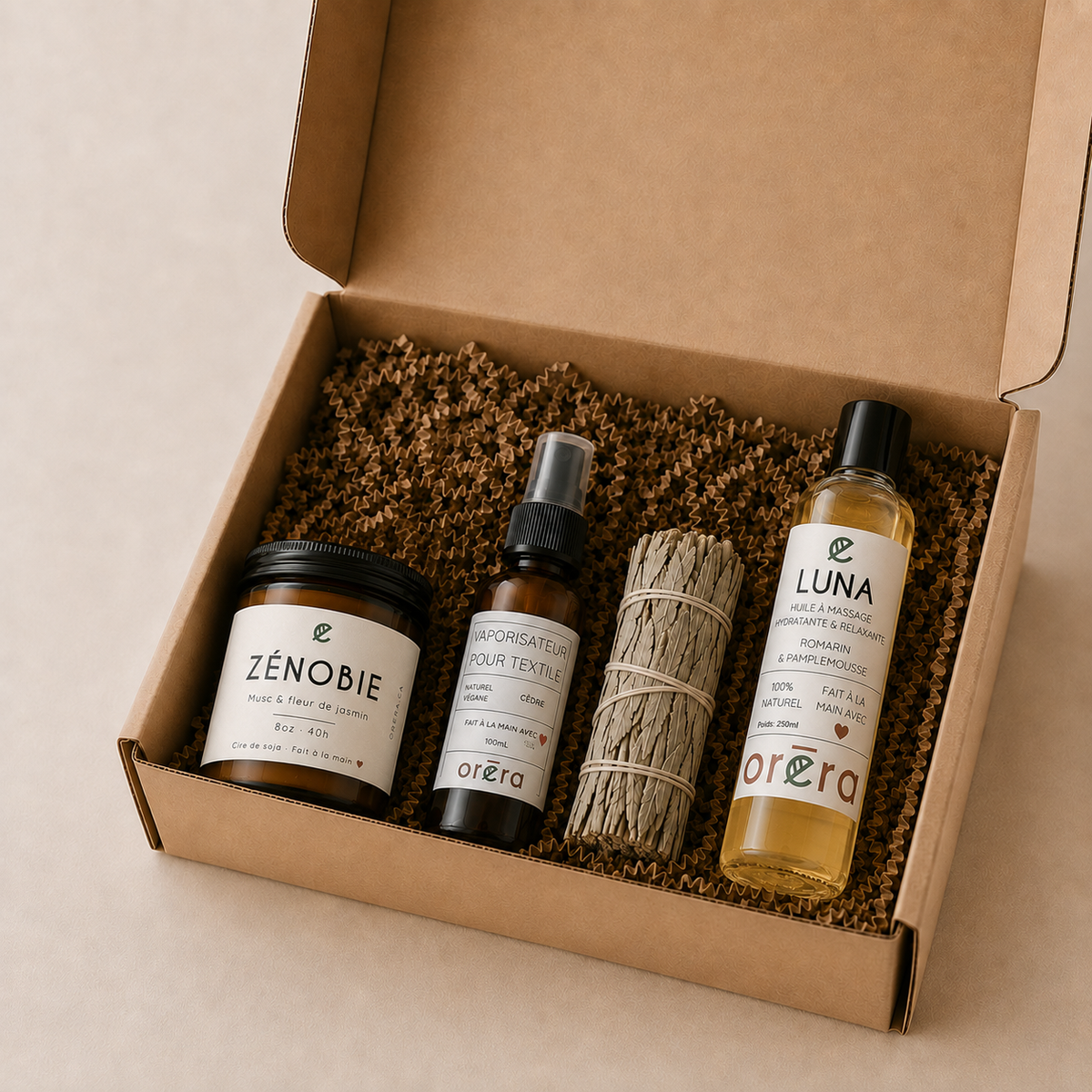 Coffret cadeau en carton naturel contenant bougie Zenobie, brume d’ambiance, bâton de sauge, et huile Luna Oréra.