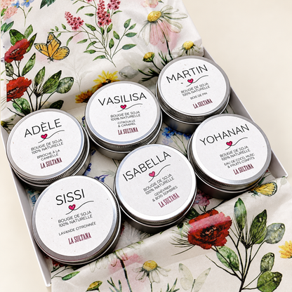 Open LUZ gift box with six La Sultana mini candles on an ivory background.