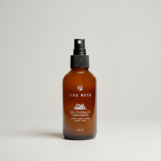 Flacon brun ambré de 120ml avec spray noir, étiquette blanche oréra tonique floral.